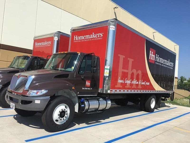A fleet of professionally wrapped box trucks built by our shop